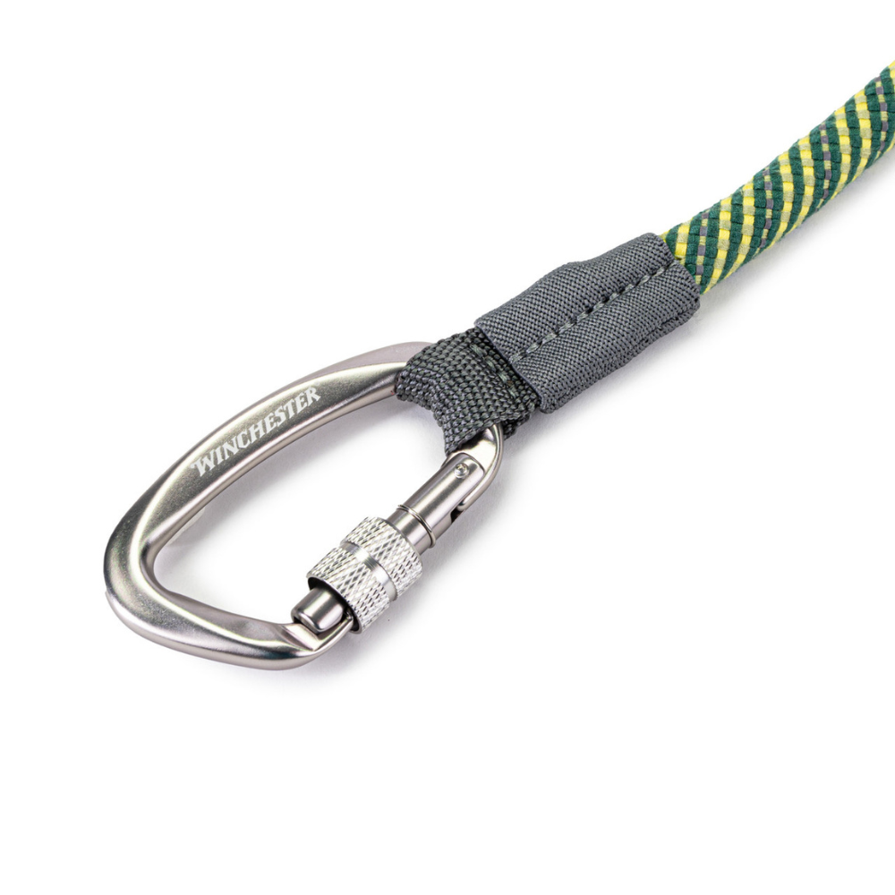 Carabiner with green and yellow rope on a white background