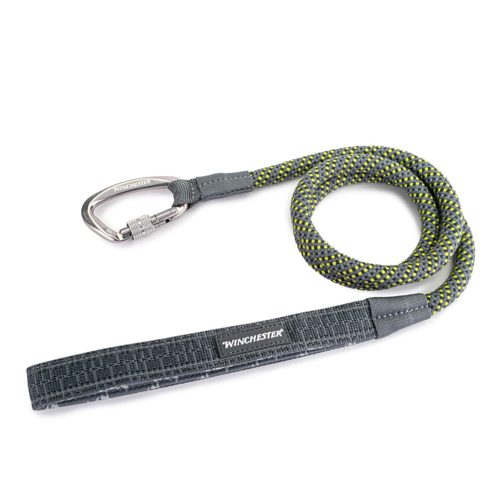 Gray dog leash with carabiner and textured handle on a white background