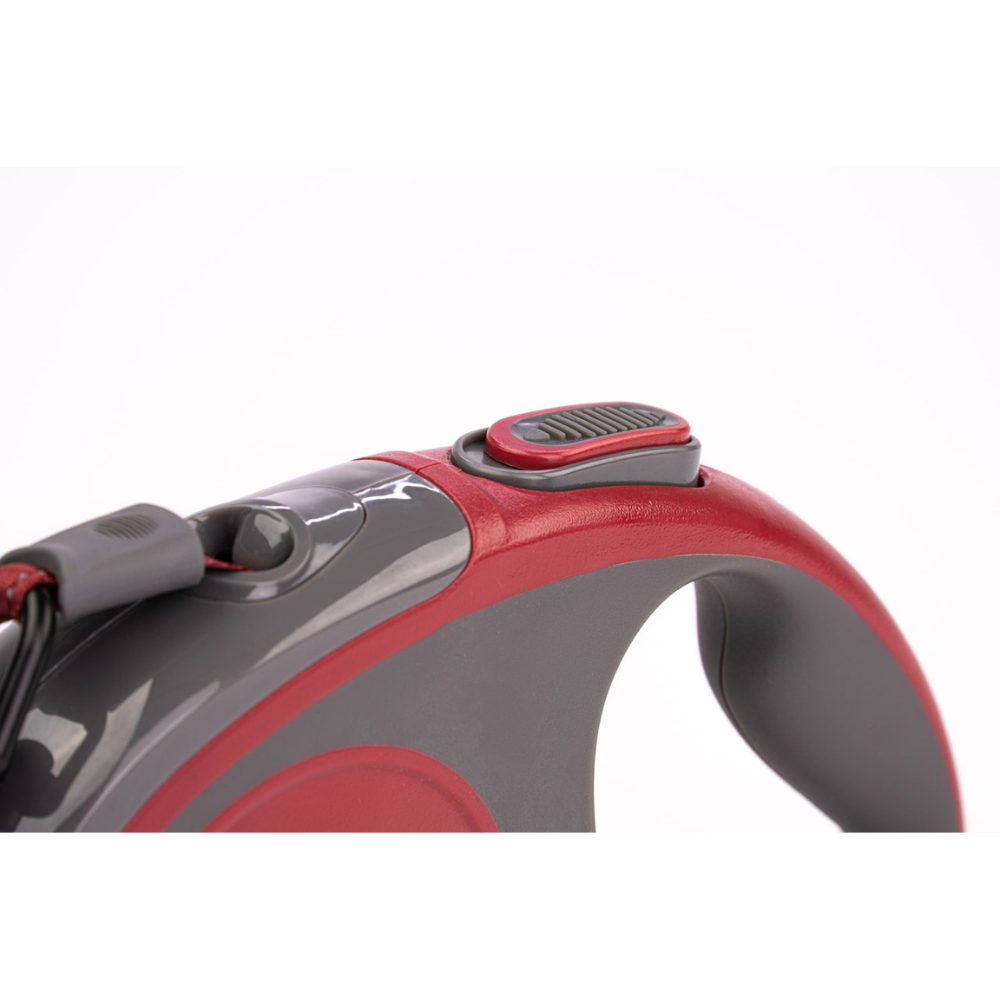 Red and gray device with a button on a white background