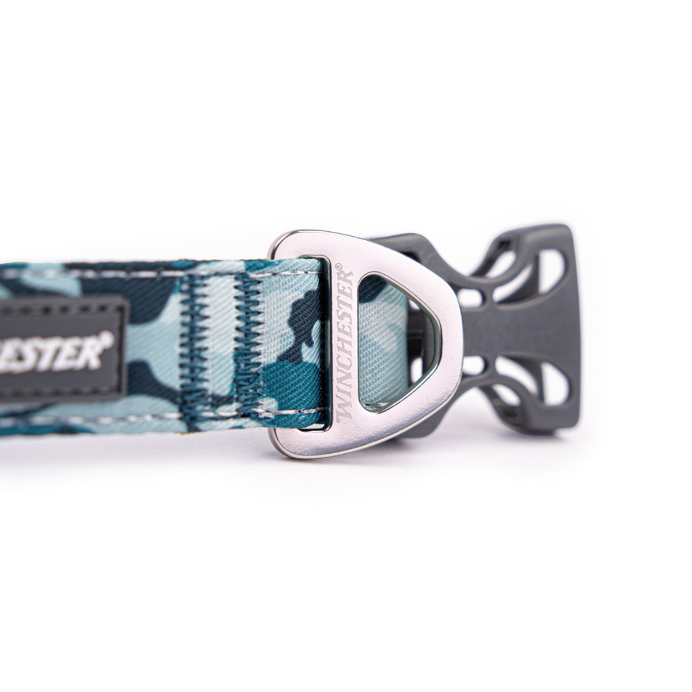 Dog collar with camouflage pattern and metal buckle on a white background