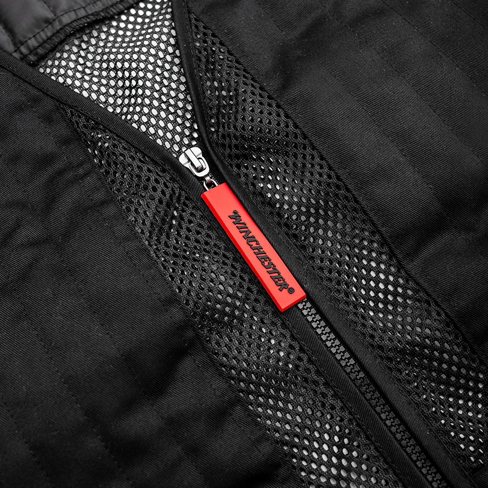 Close-up of a black jacket with a red zipper pull, featuring a brand logo.